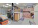 Well-organized garage with ample storage, and a full-sized refrigerator at 309 South Dr, Nokomis, FL 34275