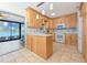 Kitchen with light wood cabinets, marble counter tops and view of the water at 309 South Dr, Nokomis, FL 34275