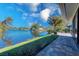 Picturesque lake view from the home's outdoor patio, with lush landscaping at 309 South Dr, Nokomis, FL 34275
