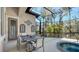 Spacious covered patio with outdoor dining set and tranquil views at 3365 Bayou Gate, Longboat Key, FL 34228