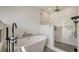 Spa-like bathroom with soaking tub and walk-in shower at 3371 Bayou Sound, Longboat Key, FL 34228