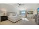 Bright bedroom with vaulted ceiling and large windows at 3371 Bayou Sound, Longboat Key, FL 34228