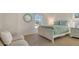 Charming bedroom featuring a full-size bed with a lovely floral bedspread at 3371 Bayou Sound, Longboat Key, FL 34228