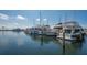 Picturesque view of a well-maintained boat dock with several boats moored on a sunny day at 3371 Bayou Sound, Longboat Key, FL 34228