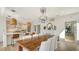 Bright dining area with a large wooden table and kitchen access at 3371 Bayou Sound, Longboat Key, FL 34228