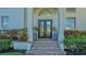 Elegant entryway with double doors and brick steps at 3371 Bayou Sound, Longboat Key, FL 34228