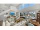 Spacious living area with views of the pool and canal at 3371 Bayou Sound, Longboat Key, FL 34228