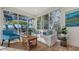 Cozy sitting area with a comfortable sofa and large windows at 3371 Bayou Sound, Longboat Key, FL 34228
