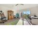 Sunlit studio with large window, wooden cabinet, and an office area at 3371 Bayou Sound, Longboat Key, FL 34228