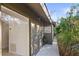 Exterior view of home showcasing a side patio and landscaping at 3439 Tobero Ln, Sarasota, FL 34235