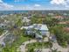 Aerial view of coastal home featuring a circular driveway and well-manicured front lawn at 3445 Anglin Dr, Sarasota, FL 34242