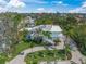 Aerial view of a home with inviting front porch and a neatly maintained lawn at 3445 Anglin Dr, Sarasota, FL 34242