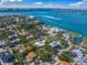 Beautiful aerial shot capturing homes near the water with a view of the city skyline in the distance at 3445 Anglin Dr, Sarasota, FL 34242