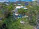 Aerial view of backyard featuring pool, patio area, and mature trees at 3445 Anglin Dr, Sarasota, FL 34242