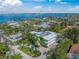 Aerial view of coastal home showcasing the surrounding landscaping and proximity to the water at 3445 Anglin Dr, Sarasota, FL 34242