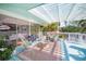 Comfortable back porch has wicker seating and a pergola at 3445 Anglin Dr, Sarasota, FL 34242