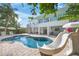 A beautiful pool with a waterslide highlights this backyard at 3445 Anglin Dr, Sarasota, FL 34242