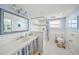 Traditional bathroom featuring a classic vanity and a shower with nautical accents at 3445 Anglin Dr, Sarasota, FL 34242