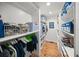 Walk-in closet with built-in shelving for clothes and shoes at 3445 Anglin Dr, Sarasota, FL 34242