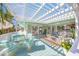 Outdoor deck area with lots of seating and views of the water, sky and trees at 3445 Anglin Dr, Sarasota, FL 34242