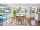 Dining room with decorative rug and views to outdoor deck with sliding glass doors to bring the outdoors in at 3445 Anglin Dr, Sarasota, FL 34242