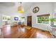 Welcoming entryway with hardwood floors, neutral walls, stylish furniture, and natural lighting, creating a warm ambiance at 3445 Anglin Dr, Sarasota, FL 34242