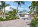 Beautiful home featuring lush landscaping and a long driveway at 3445 Anglin Dr, Sarasota, FL 34242