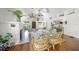 Bright living room features vaulted ceilings, ceiling fans, a fireplace, hardwood floors, and stylish décor at 3445 Anglin Dr, Sarasota, FL 34242