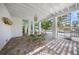 Inviting patio with dining table and spiral staircase, perfect for outdoor entertaining at 3445 Anglin Dr, Sarasota, FL 34242