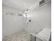 Bright shower with marble tile and rain shower head at 3445 Anglin Dr, Sarasota, FL 34242