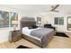 Main bedroom with king-size bed, ceiling fan, and modern furnishings at 355 N Washington Dr, Sarasota, FL 34236