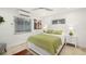 Bright bedroom with white bed and green bedding at 355 N Washington Dr, Sarasota, FL 34236