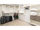 Large walk-in closet with ample shelving and hanging space at 355 N Washington Dr, Sarasota, FL 34236