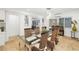 Elegant dining room with a glass table and wicker chairs at 355 N Washington Dr, Sarasota, FL 34236