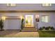 Inviting front entrance with a yellow door and brick walkway at 355 N Washington Dr, Sarasota, FL 34236