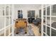 Game room with foosball table, comfortable seating, and French doors at 355 N Washington Dr, Sarasota, FL 34236