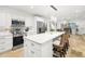 Spacious kitchen with large island, stainless steel appliances, and white cabinetry at 355 N Washington Dr, Sarasota, FL 34236