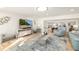 Spacious living room with comfortable seating and large TV at 355 N Washington Dr, Sarasota, FL 34236