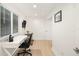 Bright home office with a white desk and chair, and ample natural light at 355 N Washington Dr, Sarasota, FL 34236