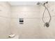 Elegant shower with decorative tile and seat at 355 N Washington Dr, Sarasota, FL 34236