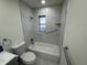Updated bathroom with a bathtub, toilet, and modern vanity at 3813 42Nd W St # 37, Bradenton, FL 34205