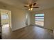 Bedroom with ceiling fan and access to a bathroom at 3813 42Nd W St # 37, Bradenton, FL 34205