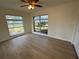 Bedroom with large windows and ceiling fan at 3813 42Nd W St # 37, Bradenton, FL 34205