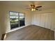 Bright bedroom with large window and ceiling fan at 3813 42Nd W St # 37, Bradenton, FL 34205