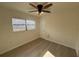 Bright bedroom with ceiling fan, hardwood floors and white walls at 3813 42Nd W St # 37, Bradenton, FL 34205