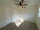 Sunny bedroom with hardwood floors and ceiling fan at 3813 42Nd W St # 37, Bradenton, FL 34205