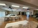 Community room with tables, chairs and a view into another room at 3813 42Nd W St # 37, Bradenton, FL 34205
