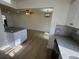 Open concept kitchen with island and view into living area at 3813 42Nd W St # 37, Bradenton, FL 34205