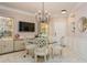 Bright dining room featuring a glass table and modern chandelier at 4207 S Dale Mabry Hwy # 11103, Tampa, FL 33611