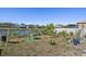 Fenced backyard with a swing set and landscaping at 509 Powder View Dr, Ruskin, FL 33570